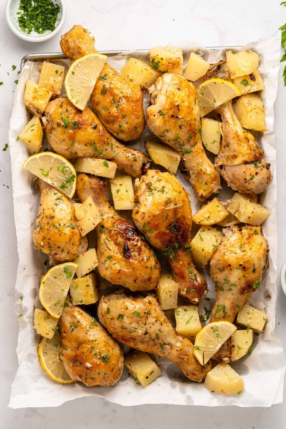 A tray of baked parmesan chicken 