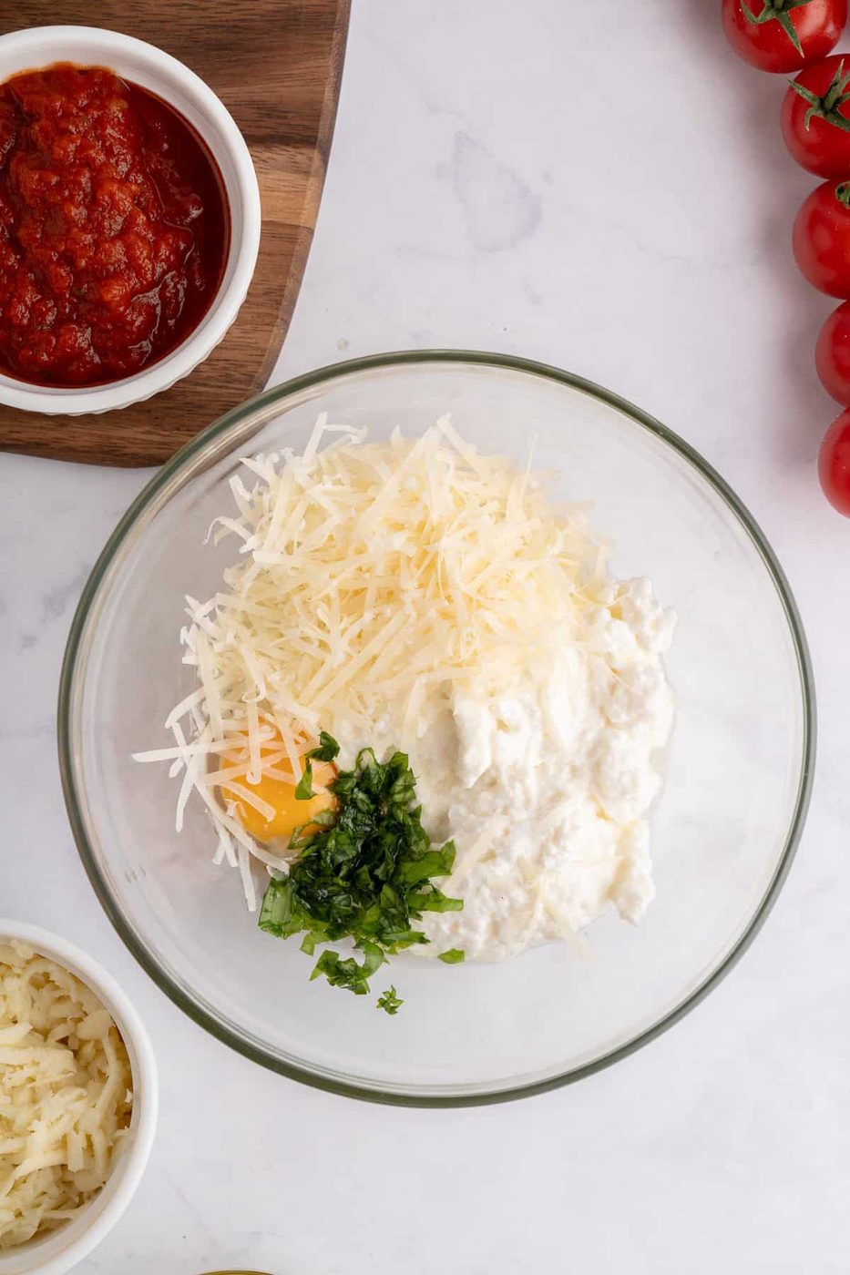 Picture of a bowl with the ricotta, egg, and parmesan in it. 