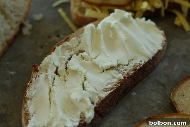 Juicy honey-roasted pear slices carefully arranged on top of caramelized onions and cheddar.