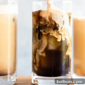 Finished Pumpkin Cream Cold Brew topped with a thick layer of frothy cream.