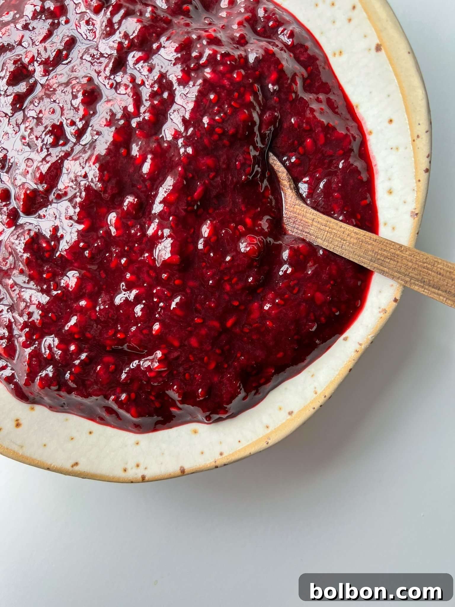Freshly made chia jam in a glass jar, showcasing its vibrant color and thick texture, ready to be enjoyed.
