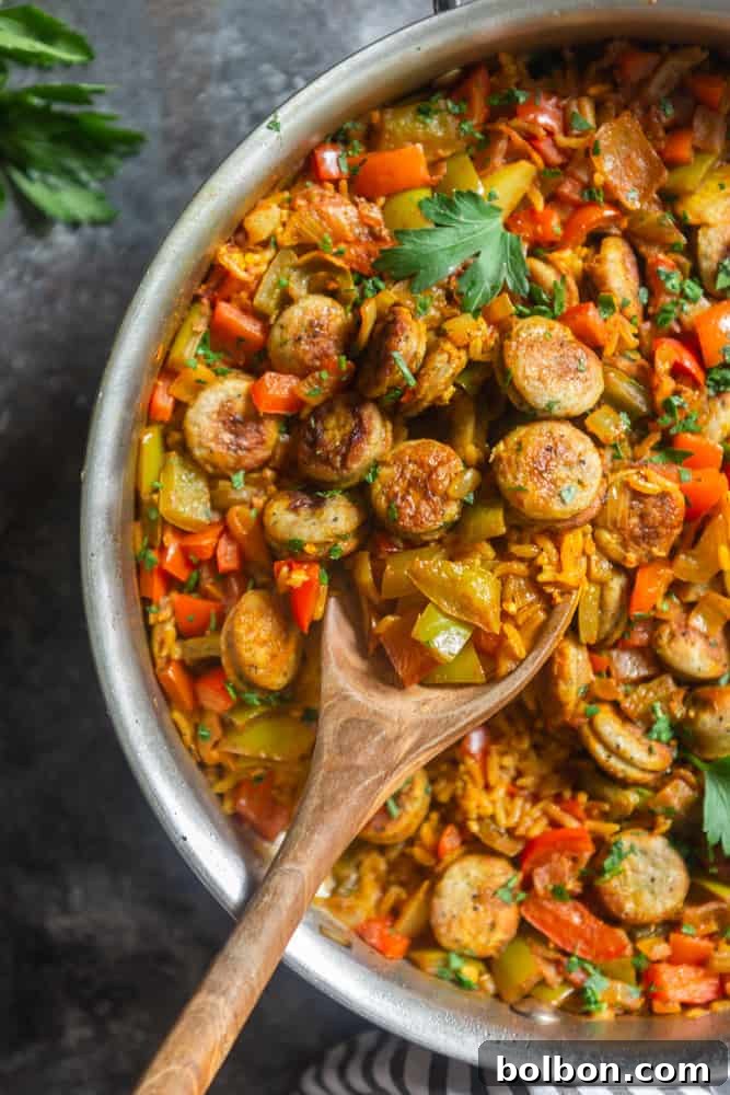 One-Pot Sausage and Rice Skillet with serving spoon, showcasing a healthy, easy dinner recipe perfect for weeknights