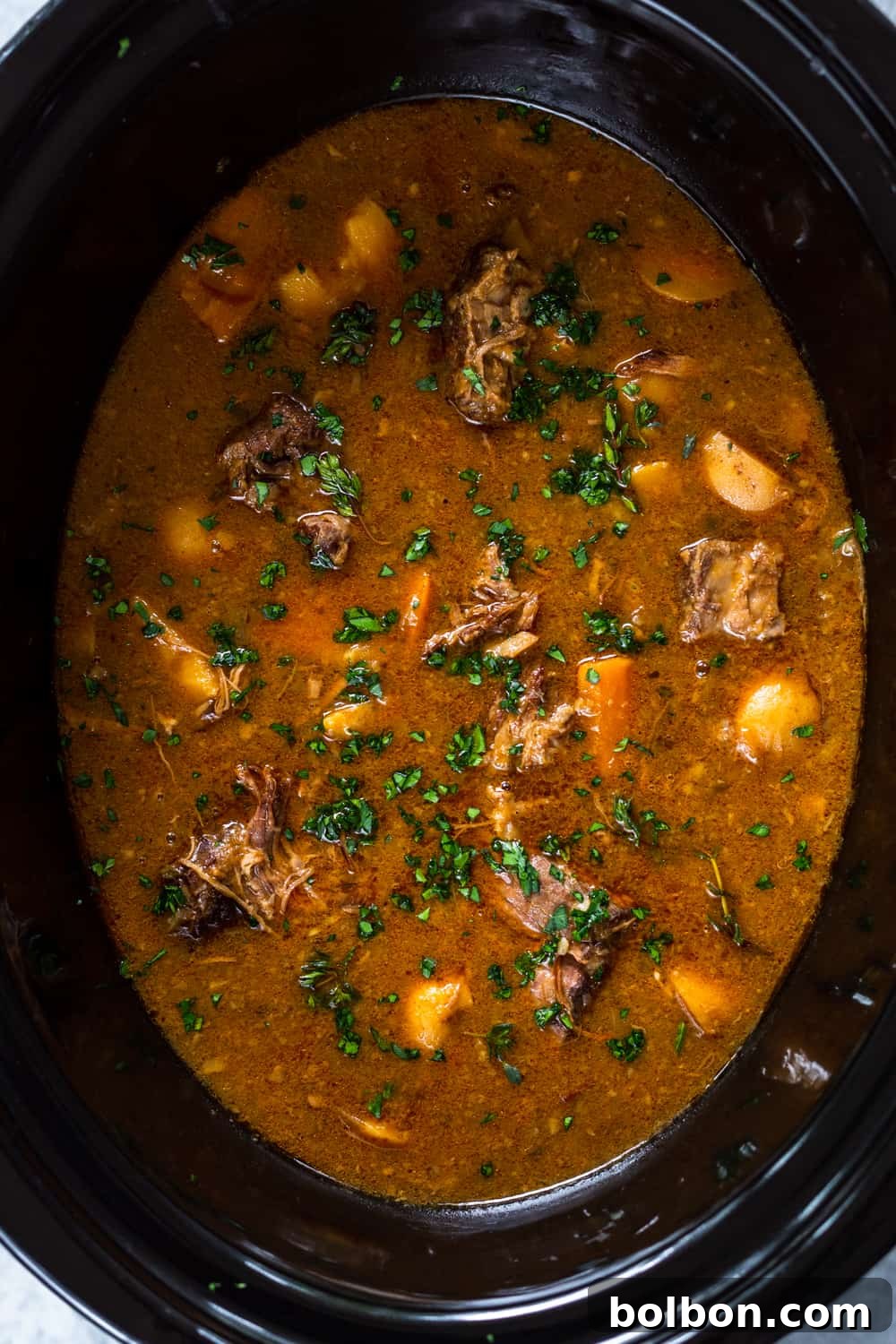Close-up of tender beef chunks and vegetables in a Slow Cooker Irish Beef Stew.