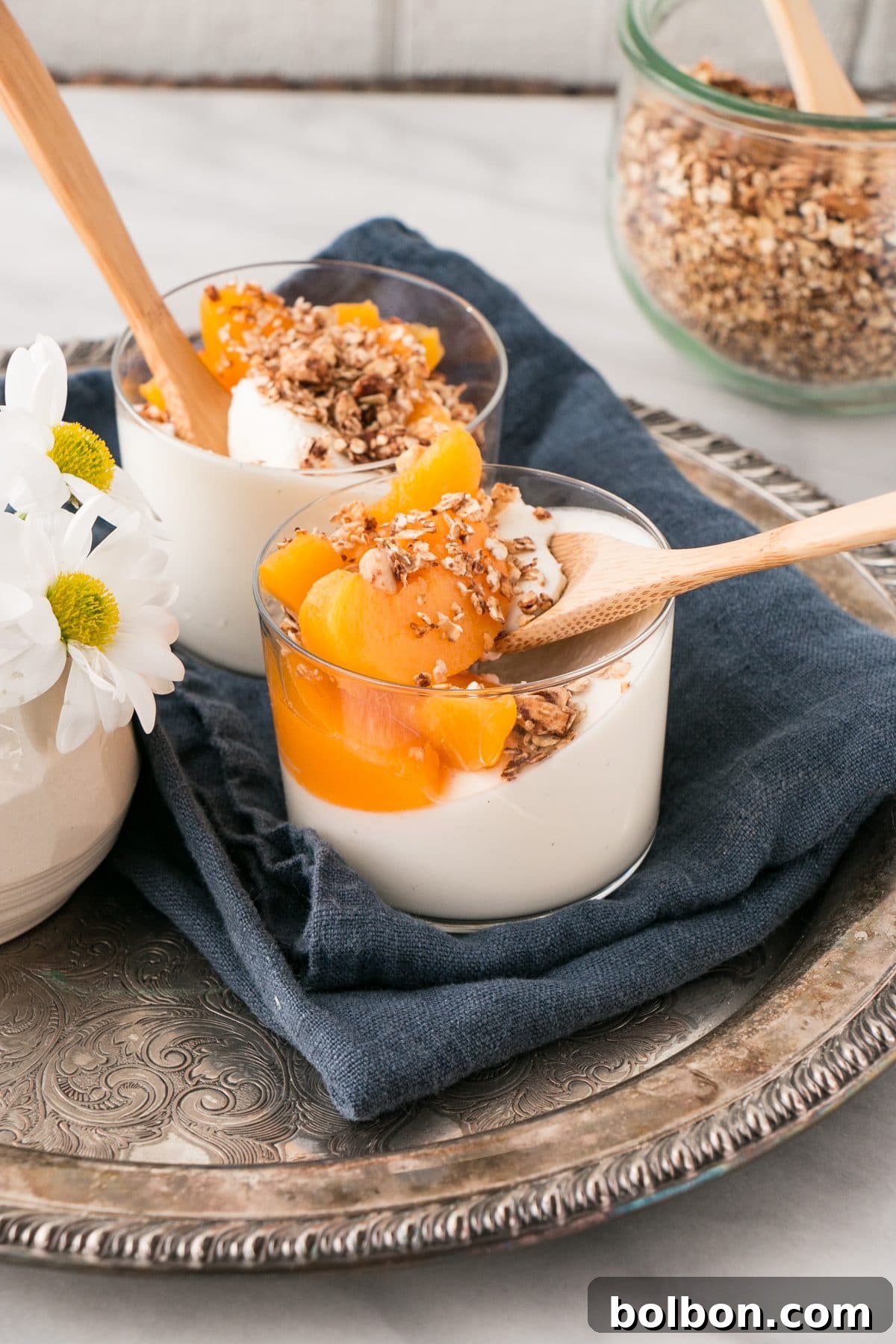 Peaches and Cinnamon Granola with Yogurt Panna Cotta in a glass