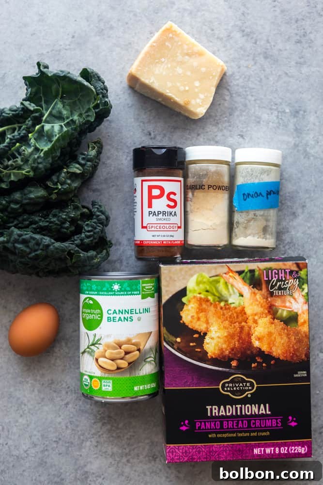 Fresh ingredients for White Bean and Kale Patties, including a can of cannellini beans, a bunch of vibrant kale, eggs, and various spices, thoughtfully arranged on a kitchen counter.