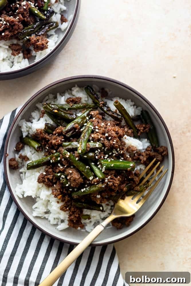 Delicious Green Bean and Ground Beef Stir Fry in a skillet, ready to be served over rice