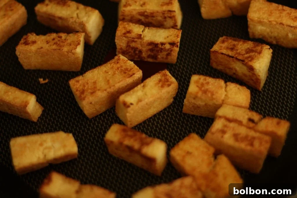 Perfect Tofu Secrets 13 A serving of crispy, flavorful tofu, ready to be enjoyed in a variety of dishes.
