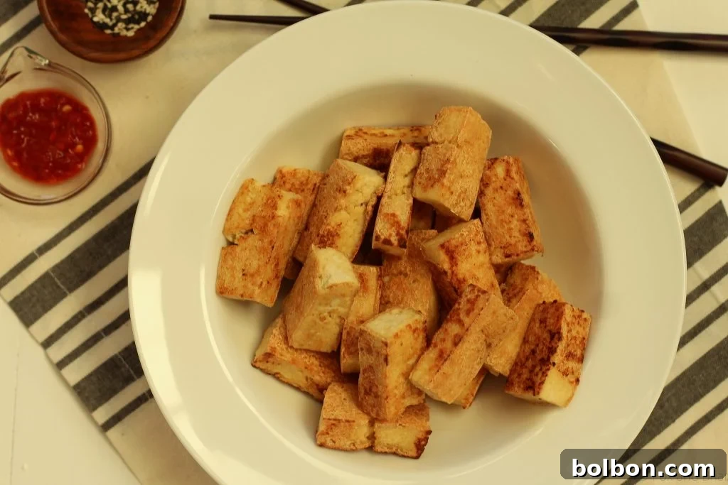Perfect Tofu Secrets 15 A final close-up of beautifully crispy tofu, emphasizing its inviting texture and golden color.