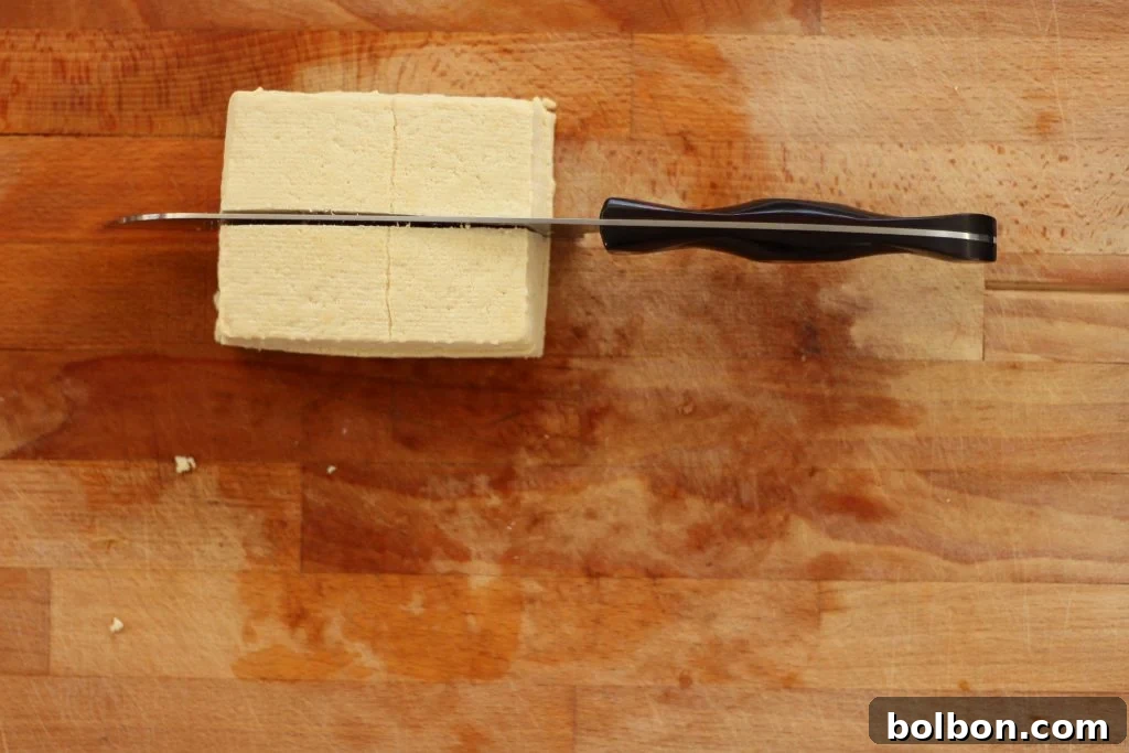 Perfect Tofu Secrets 8 Four square-shaped pieces of tofu after cutting the slabs across the middle.