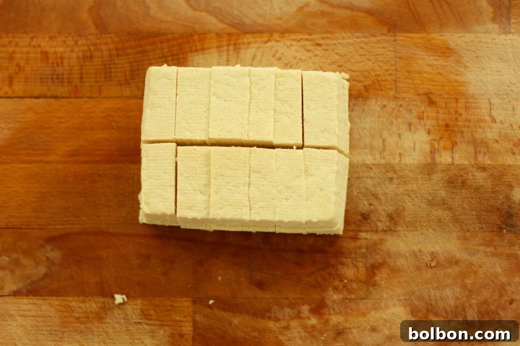 Perfect Tofu Secrets 9 Tofu sliced into smaller, uniform rectangular pieces, perfect for pan-frying.