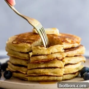 Perfectly Fluffy Buttermilk Pancakes 6 A stack of golden brown buttermilk pancakes.