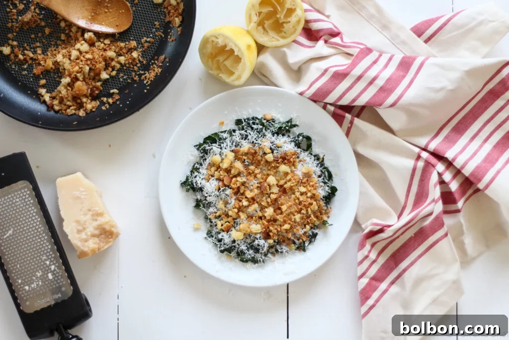 Ava Genes Signature Kale Salad 2 A beautifully plated 5-ingredient kale salad, showcasing tender massaged kale, generously grated cheese, and crispy homemade breadcrumbs.