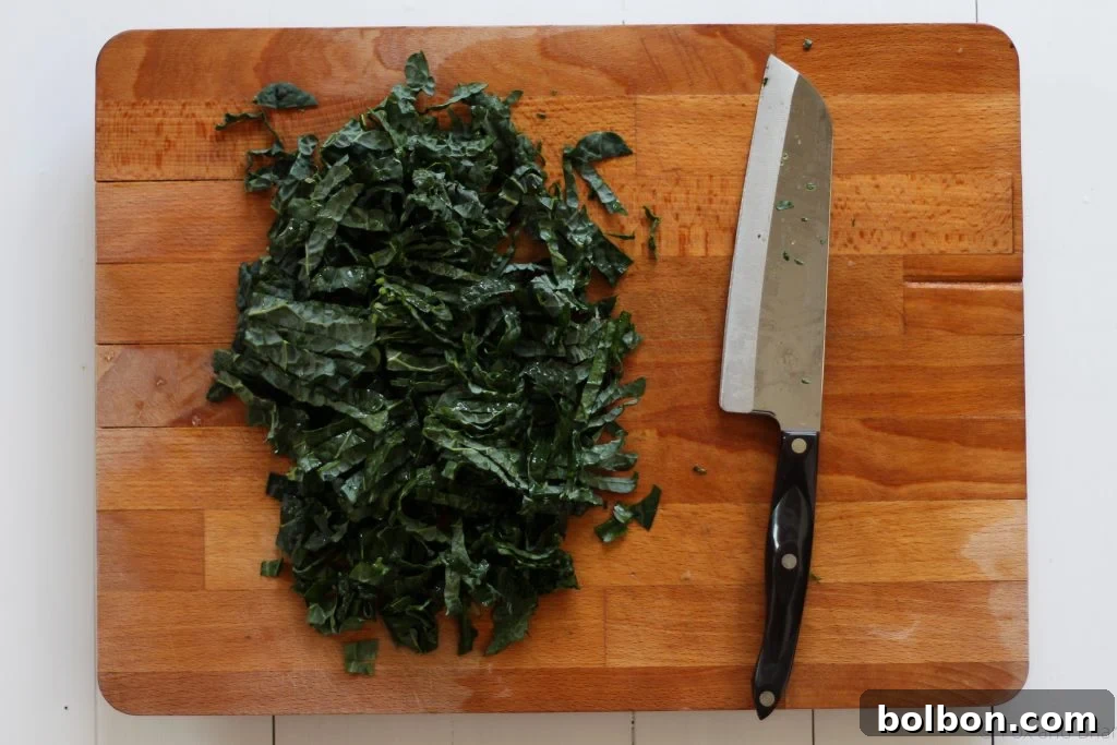 Ava Genes Signature Kale Salad 7 A closer view of the thinly sliced, tender massaged kale, glistening with dressing.