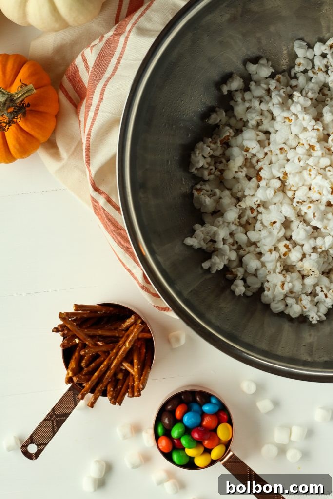 Marshmallow popcorn bars that are stuffed with treats. Plus I made you a playlist!