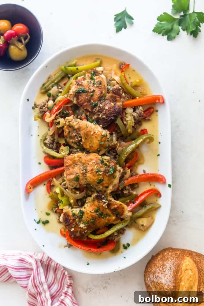 Chicken Scarpariello served on a elegant white platter, garnished with fresh herbs, ready to be enjoyed.