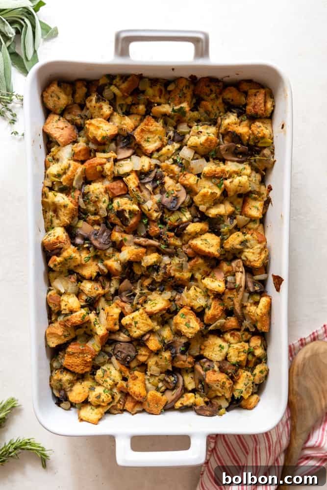 Rustic Mushroom Leek Stuffing 5 Mushroom and leek stuffing baked to a golden brown perfection in a rectangular white ceramic baking dish, ready to be served.