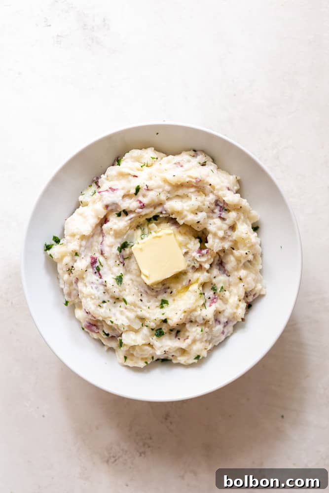 Creamy garlic mashed potatoes in a white bowl