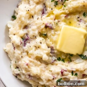 Beautifully plated Roasted Garlic Mashed Potatoes.