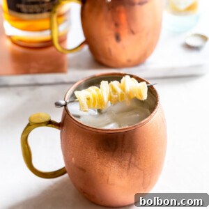 Finished Gingerbread Irish Mule cocktail with ingredients.