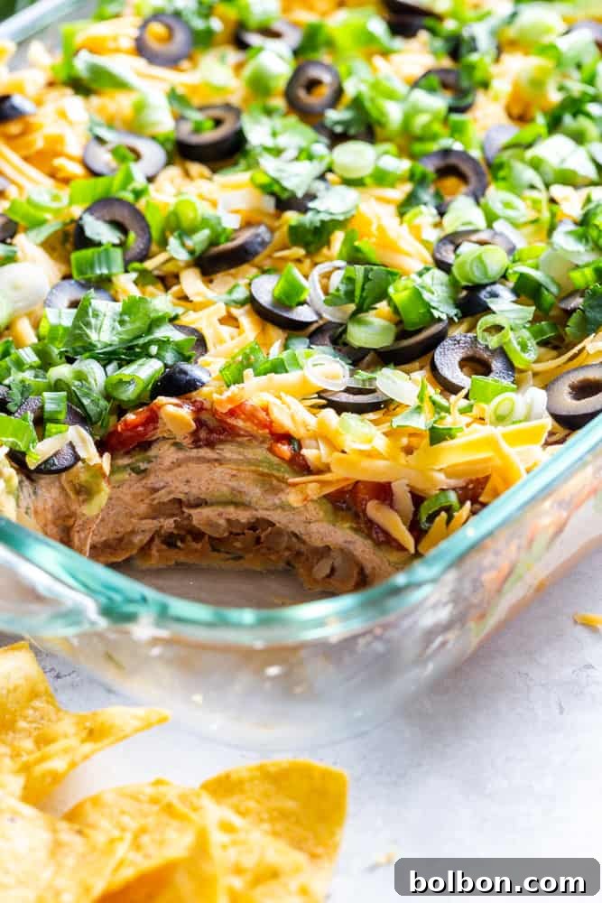 Seven Layer Fiesta Dip 6 Closeup of seven layer dip in a glass baking dish