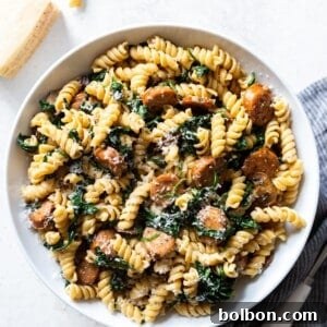 A delicious serving of Sausage and Mushroom Pasta, garnished and ready to be enjoyed.