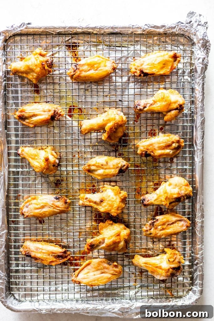 Crunchy Oven-Baked Chicken Wings 6 Close-up of baked chicken wings with crispy skin.