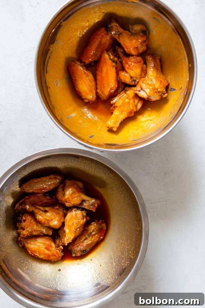 Crunchy Oven-Baked Chicken Wings 8 A bowl of honey buffalo sauce.