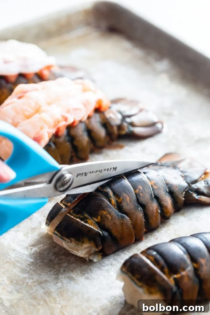 Step-by-step image showing the initial cut into a lobster tail shell