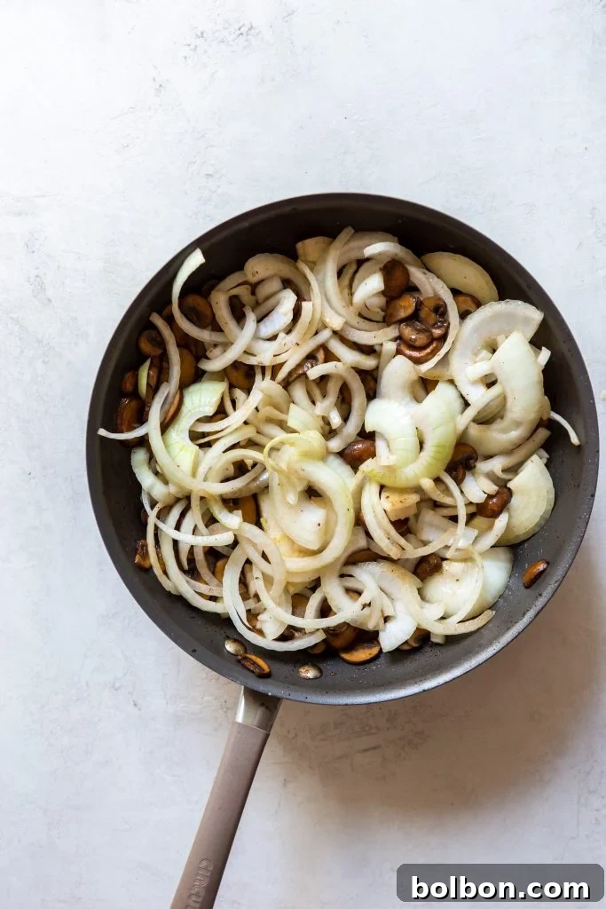 Garlic being minced for the rich Stroganoff sauce.