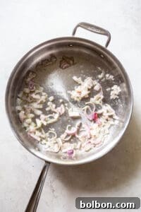 Sautéing shallots and garlic in butter.