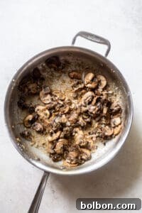 Flour sprinkled over the mushroom mixture to create a roux.