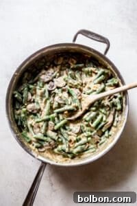 Baked green bean casserole topped with golden French fried onions.