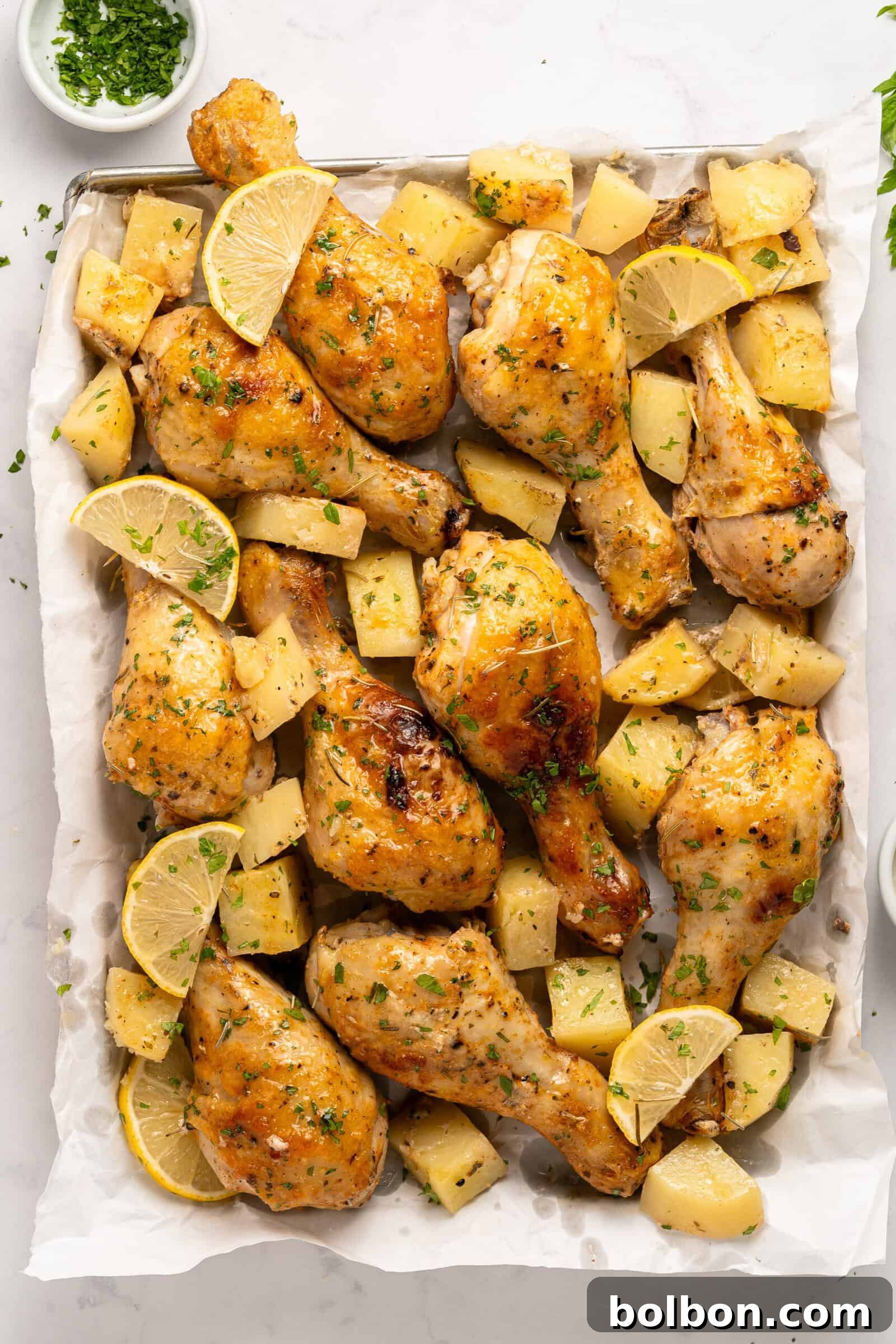 Golden Parmesan Chicken 3 A beautifully roasted tray of baked parmesan chicken and potatoes, ready to be served.