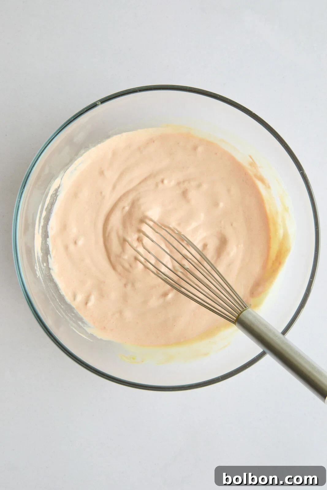 The fully mixed, creamy Mac Sauce, perfectly blended and ready to be set aside or refrigerated in a bowl.