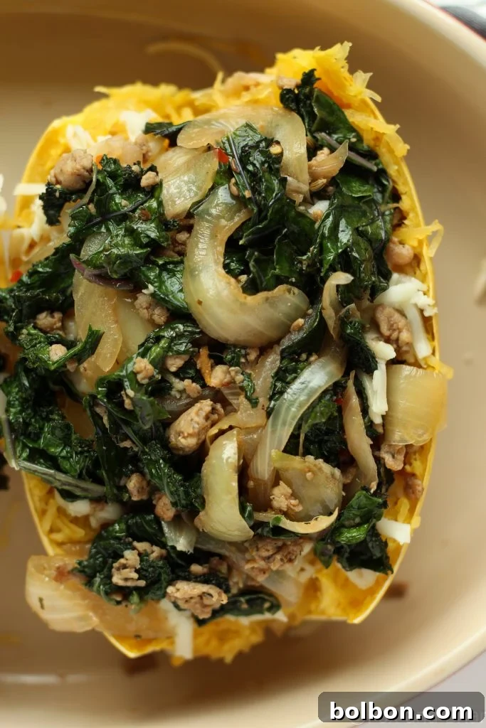 Close-up of the prepared boats with layers of filling and cheese.