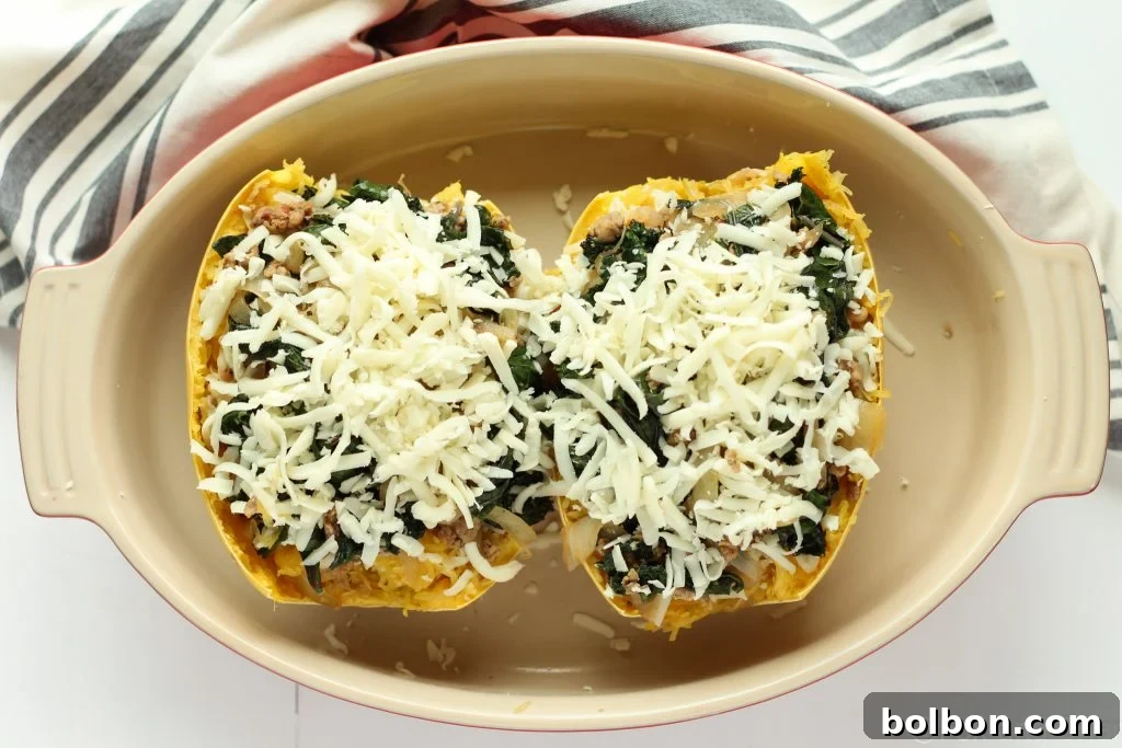 A final sprinkle of mozzarella cheese over the sausage and kale topping.