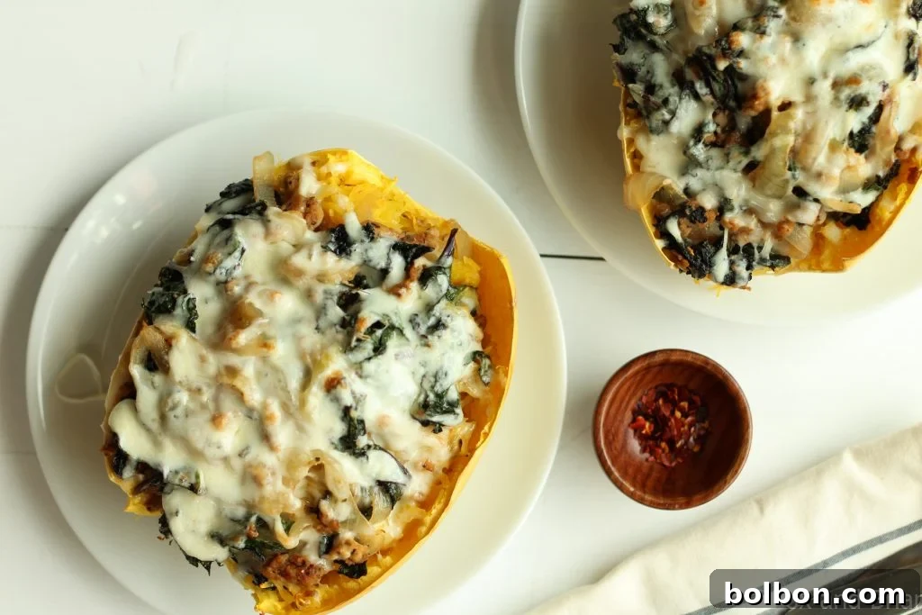Finished Sausage and Kale Spaghetti Squash Boats, hot from the oven with bubbly cheese.