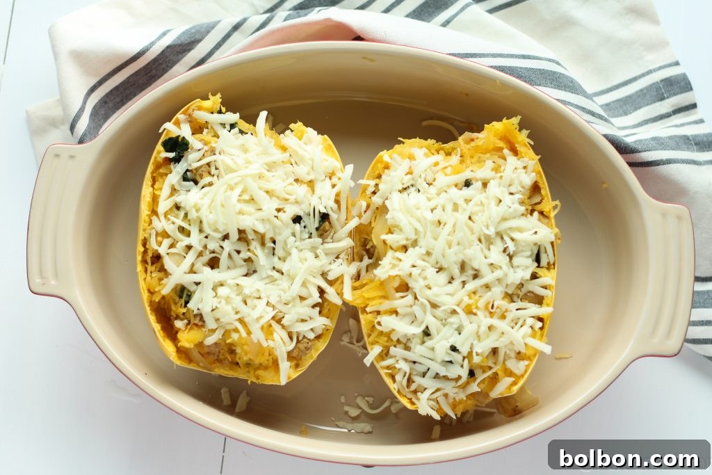 Another view of the spaghetti squash boat, generously topped with cheese.