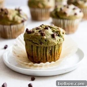 Close-up of a freshly baked spinach banana muffin with chocolate chips