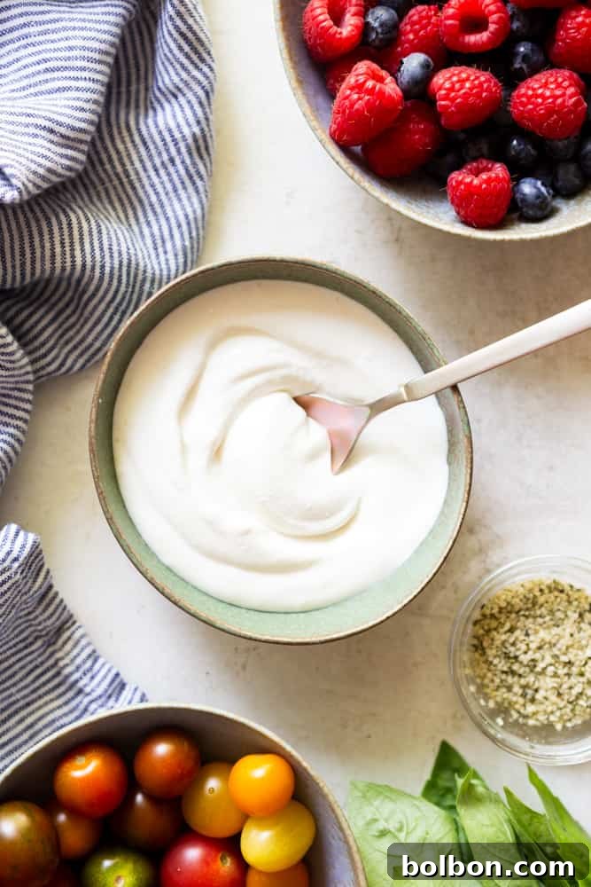 Whipped cottage cheese in a white bowl, ready to be served
