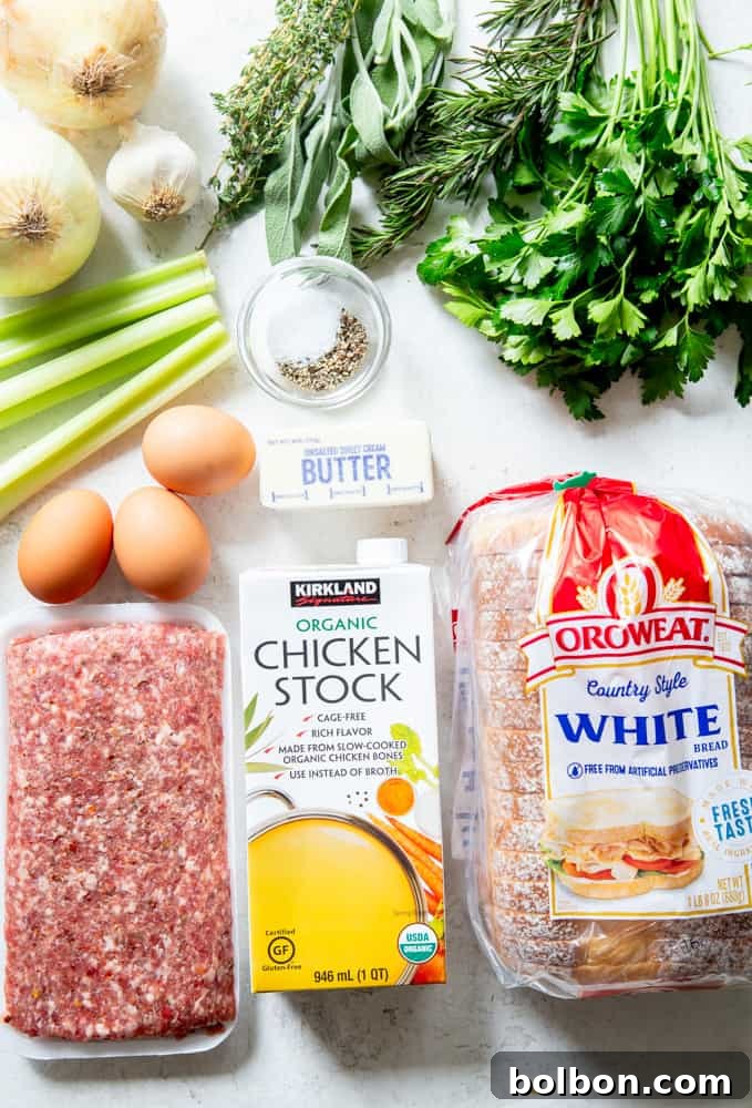 Timeless Savory Sausage Stuffing 5 Ingredients for sausage stuffing - fresh herbs, onions, garlic, celery, salt, pepper, butter, eggs, sausage, chicken stock, and white sandwich bread cubes.