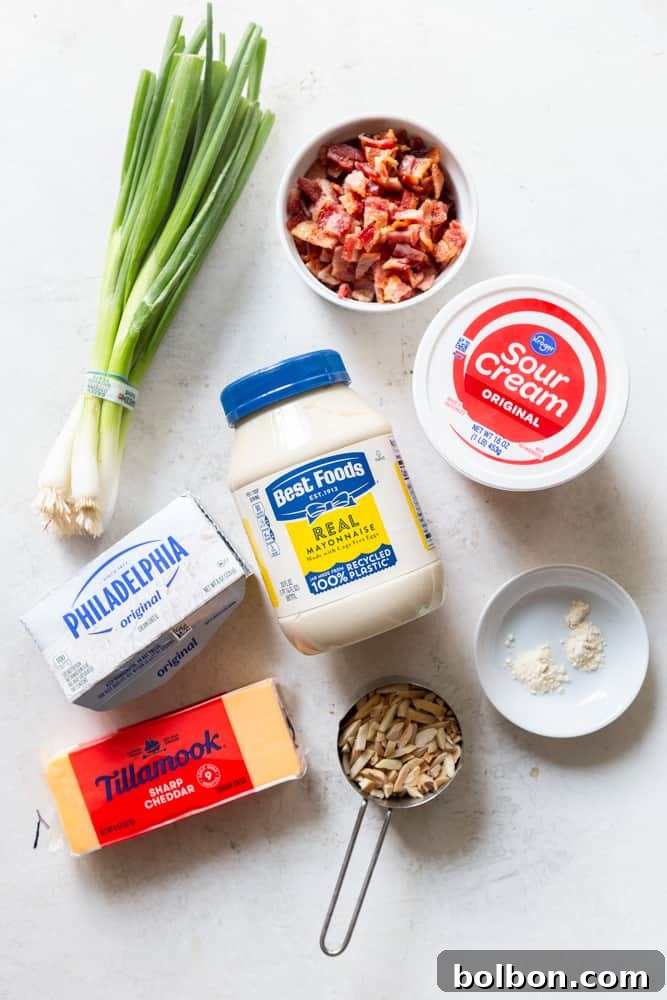 Irresistible Party Dip 3 Ingredients for million dollar dip: Green onions, chopped cooked bacon, sour cream, mayonnaise, cream cheese, sharp cheddar cheese, slivered almonds, garlic powder, onion powder.