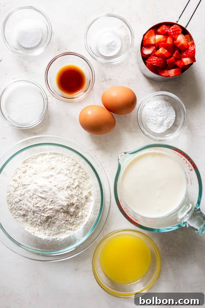 Ingredients for strawberry pancakes: Flour, buttermilk, melted butter, eggs, baking soda, baking powder, salt, sugar, vanilla extract, chopped fresh strawberries