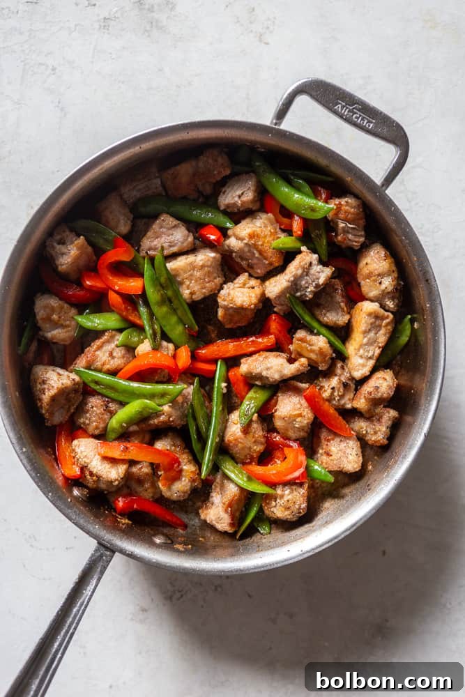 Sweet and Sticky Honey Garlic Pork Stir Fry 7 red bell peppers and snap peas added back to the pan after pork is browned.