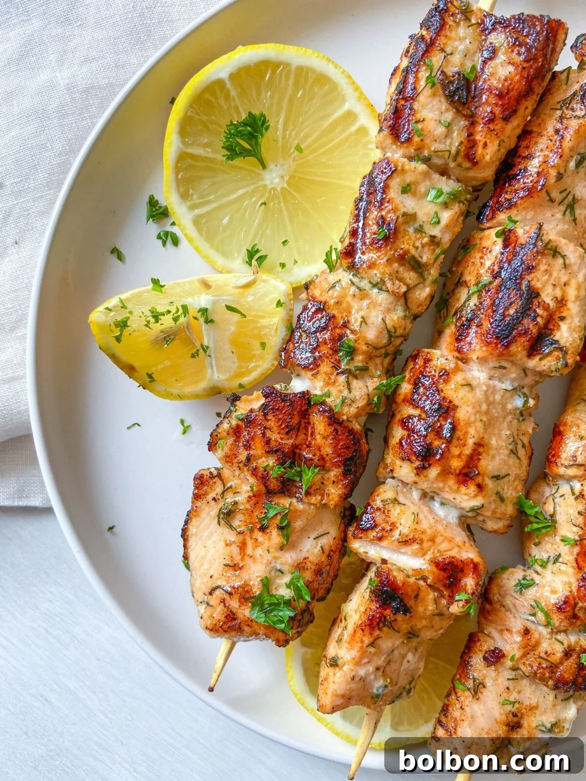 Smoky Salmon Kabobs 2 Grilled salmon skewers with fresh dill and lemon