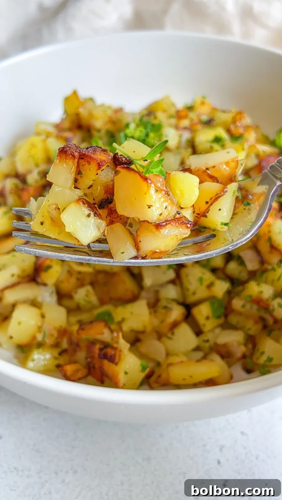 Crispy Potato Skillet 2 Crispy Potato Hash with fresh herbs, ready to be served