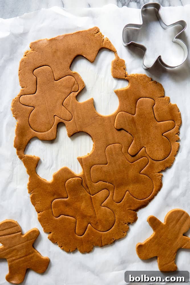 Cutting out the gingerbread dough into shapes.