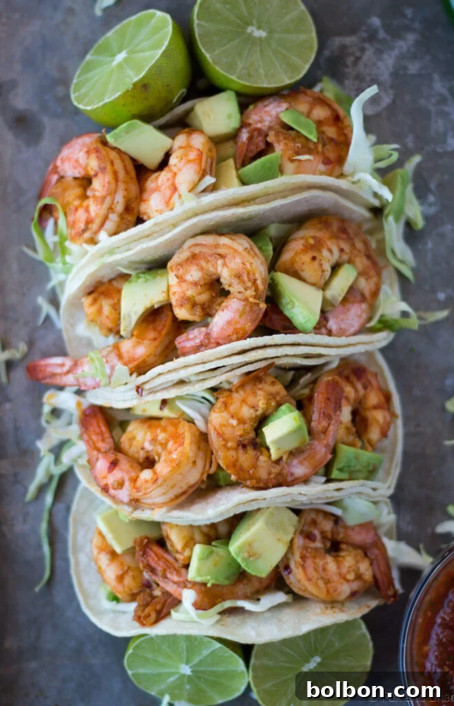 Zesty Chili Lime Shrimp Tacos 9 A plate of two delicious chili lime shrimp tacos with fresh toppings.