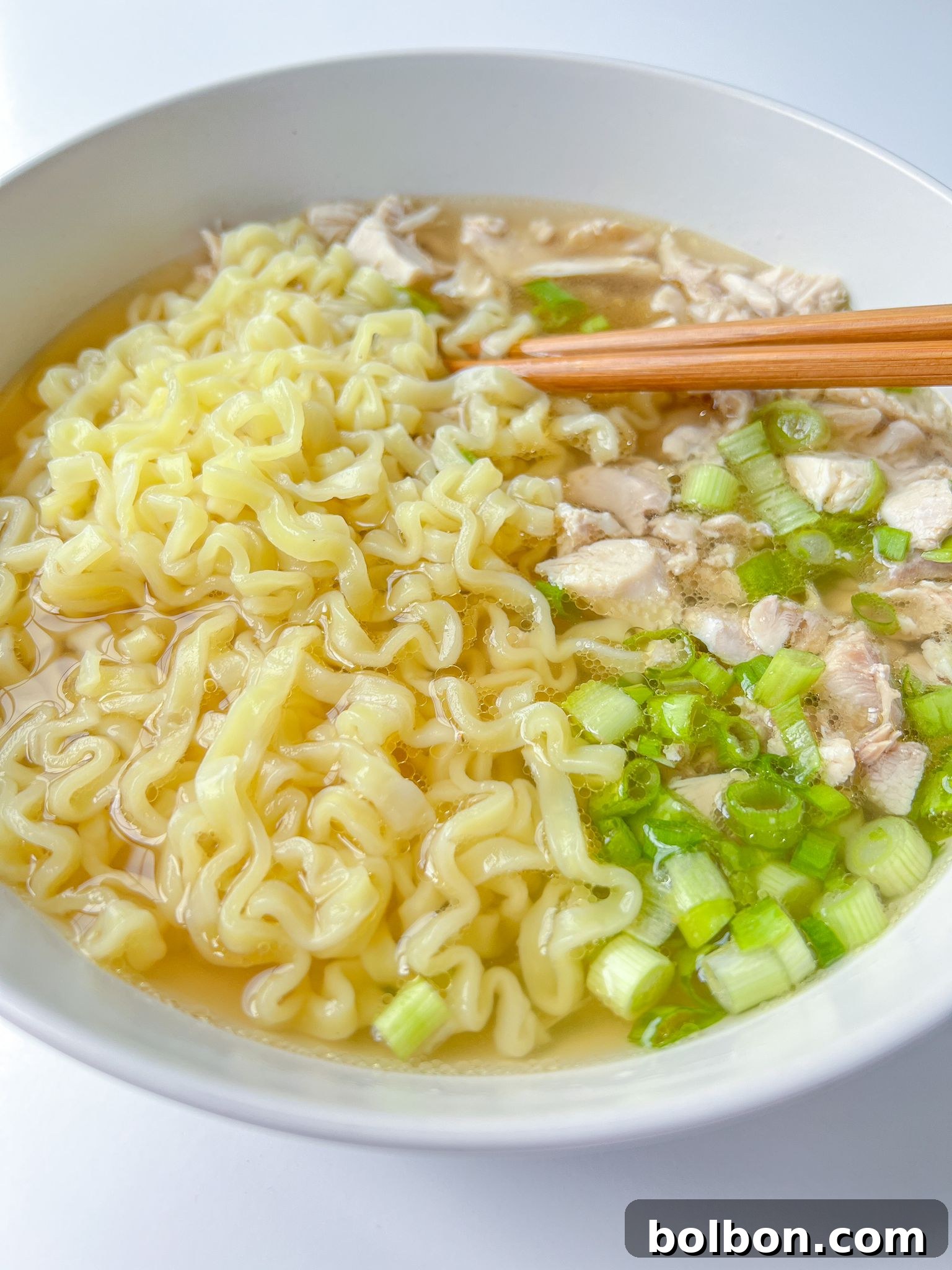 ramen noodle soup in a bowl with chopsticks
