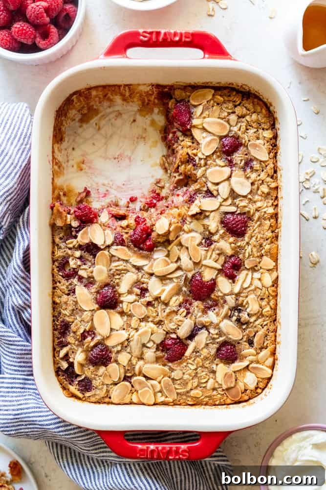 Close-up of baked Raspberry Almond Oatmeal, showing the texture and berries embedded within.